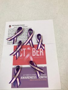 Women's issues of breast cancer together domestic violence ribbons